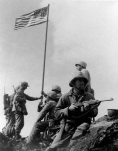 First flag raising at Iwo Jima.